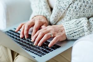 person typing on laptop
