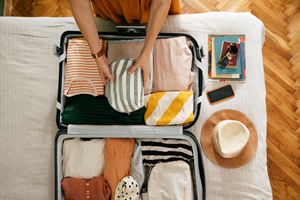 woman packing suitcase